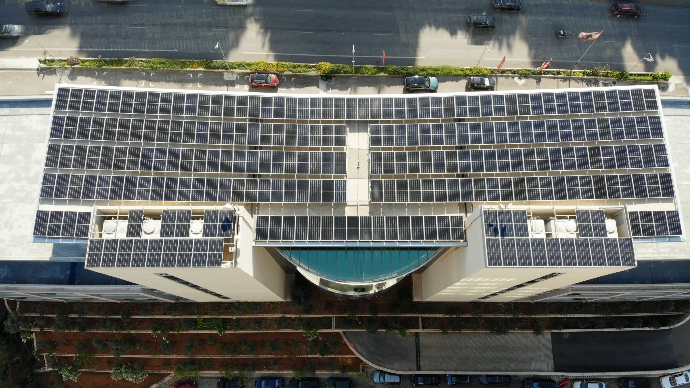 Aerial photo of the Beirut East Gate building, its roof covered by the solar array